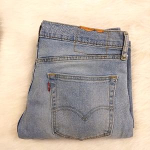 JEANS Levi's 34X32, distresssd holes in knees, missing patch.